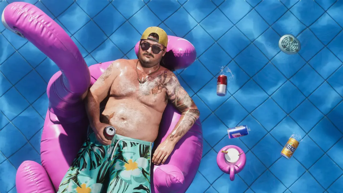 Cal Hampton floating in a pool on a flamingo float in GTA 6
