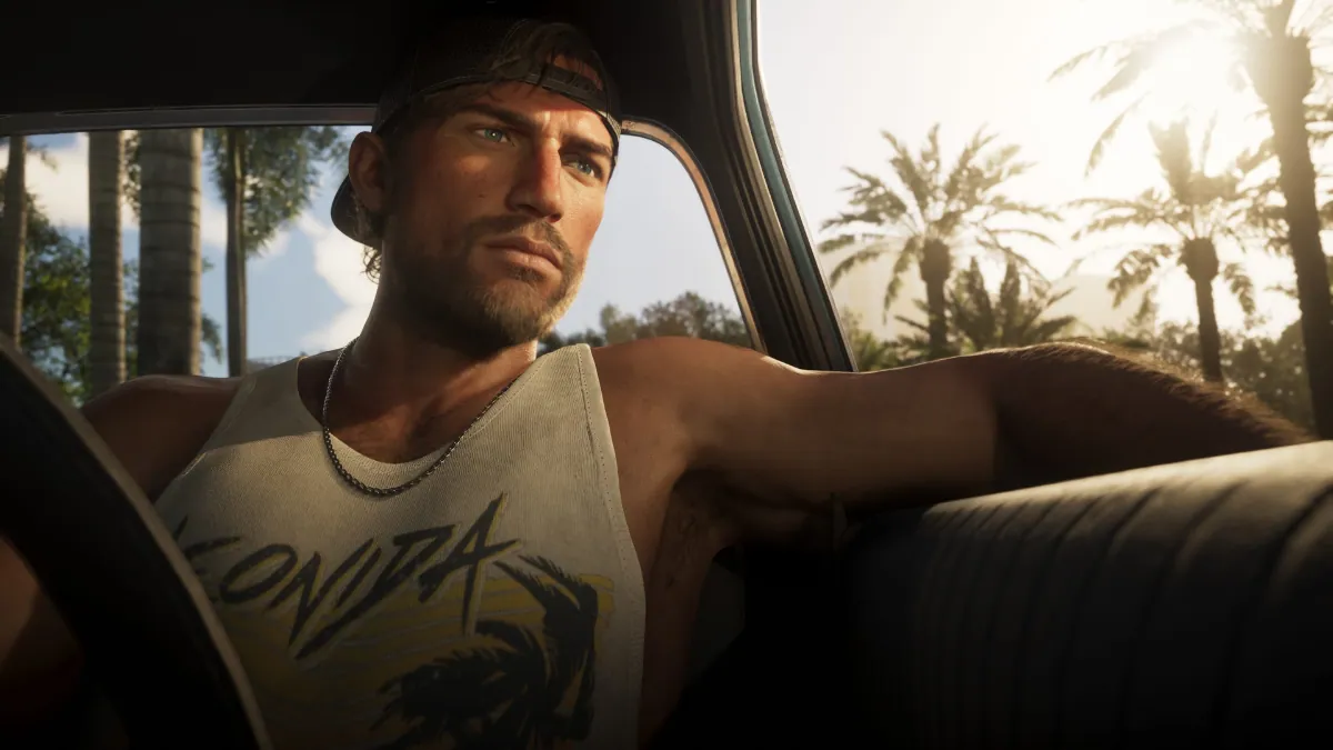 GTA 6 character Jason relaxing in car during sunset with palm trees in background