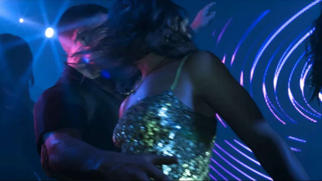 Jason and Lucia dancing in a nightclub in GTA 6 Trailer 2, surrounded by neon lights and energetic vibes.