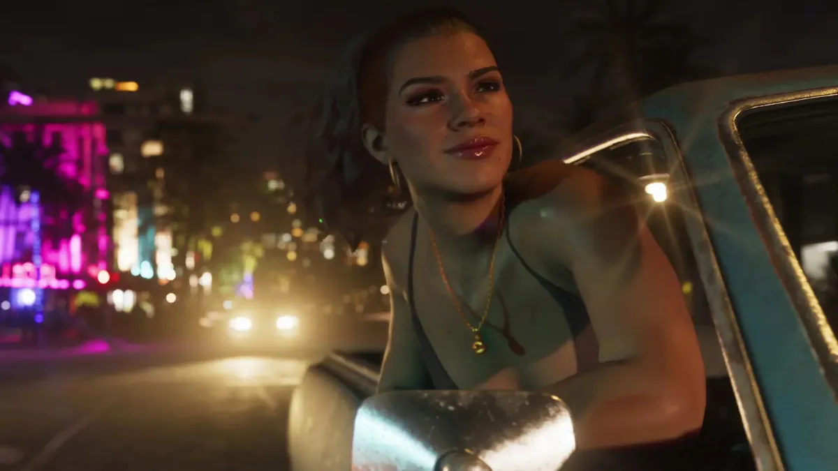 Lucia smiling from car window during nighttime city cruise in GTA 6