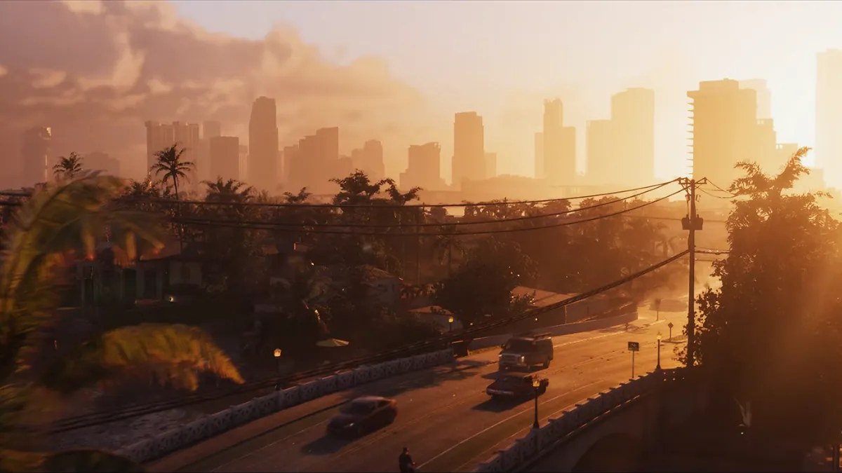 GTA 6 sunset view of Vice City with palm trees, residential neighborhoods, cars on a bridge, and a glowing skyline of high-rise buildings