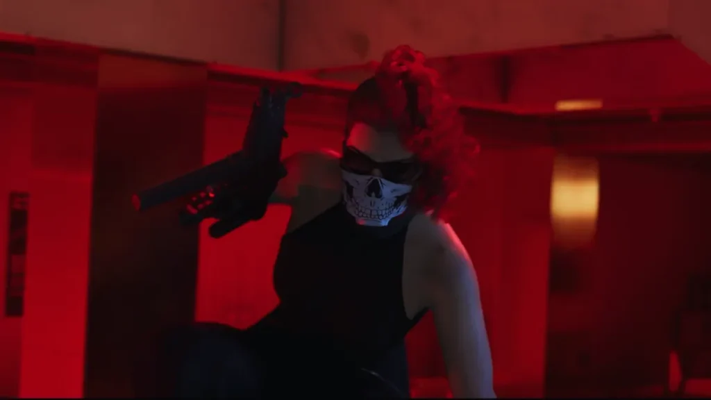 Lucia masked with a skull face mask holding a gun during a robbery scene in GTA 6 Trailer 2